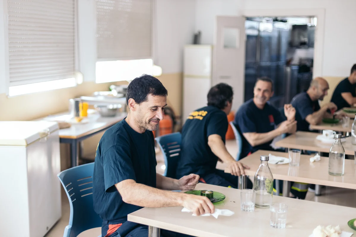 Firefighters sharing breakfast together at their station