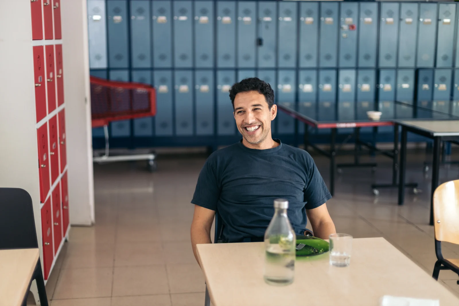 A firefighter smiling during a break at the station